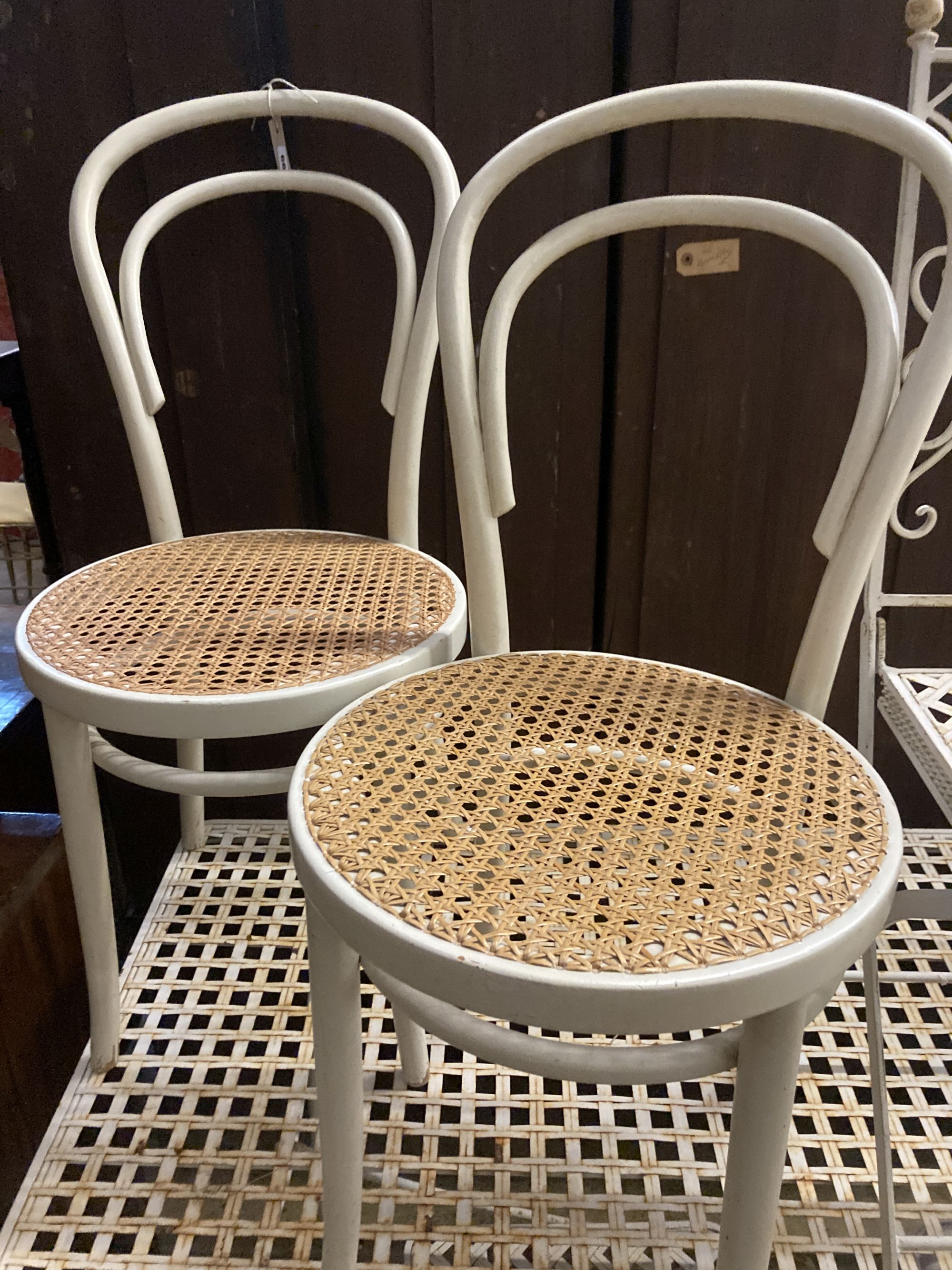 Two Edwardian cane seat chairs and a pair of painted Bentwood cane seat chairs